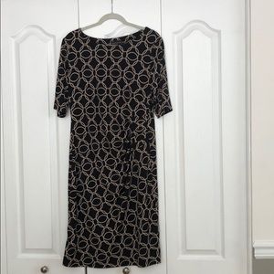 Scoop neck dress. Black with tan design.